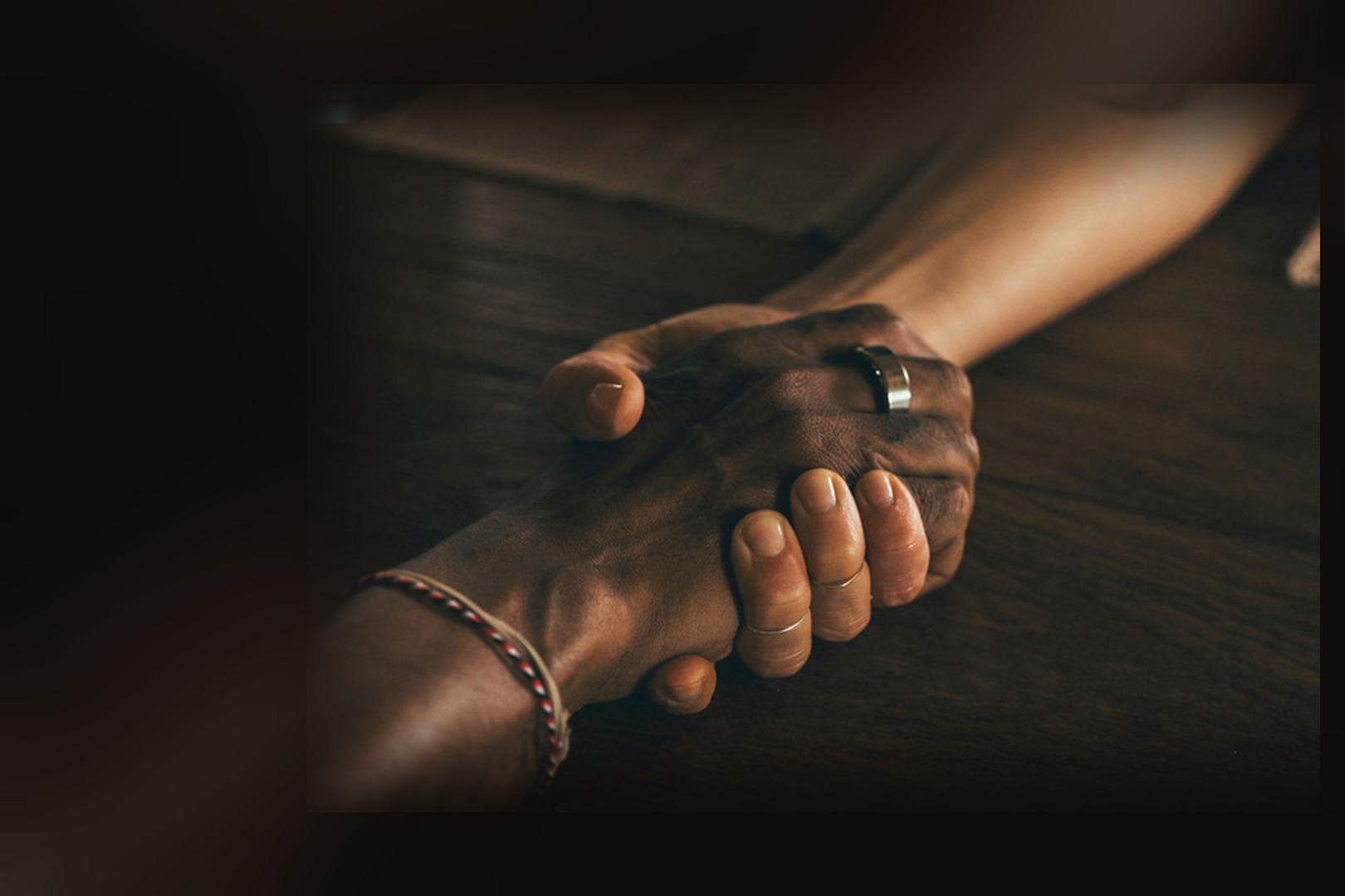 Two hands holding each other